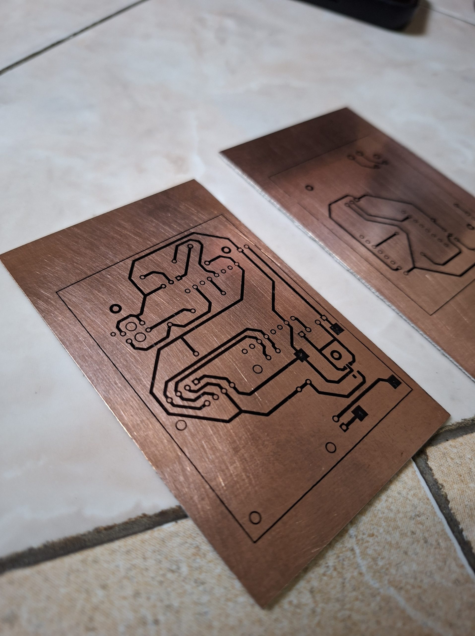 Close-up,Of,Etched,Circuit,Board,Designs,On,Copper,Plates,,Showcasing